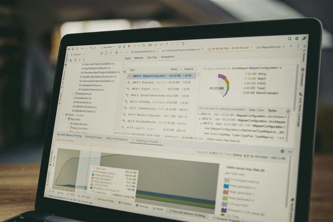 Computer screen showing code, metrics, and analysis tooling